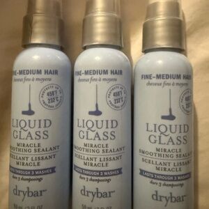 Three 2 ounce bottles of Drybar Liquid Glass Miracle Smoothing Sealant